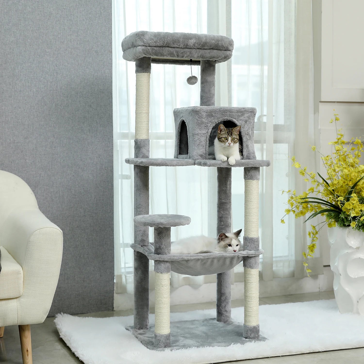 Large multi-layer cat tree tower with scratching posts, hammocks, and cozy condo for indoor cats