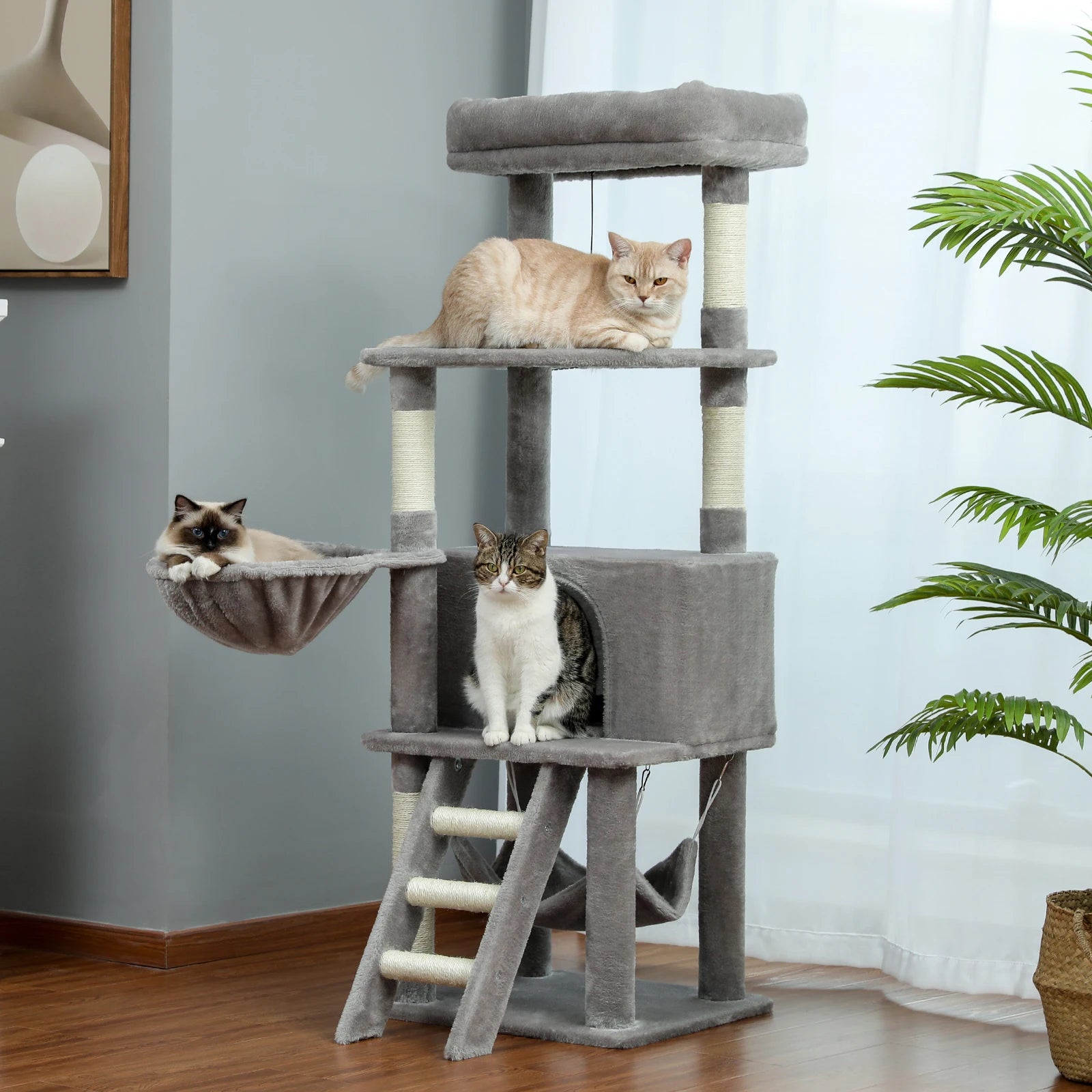 Large multi-layer cat tree tower with scratching posts, hammocks, and cozy condo for indoor cats