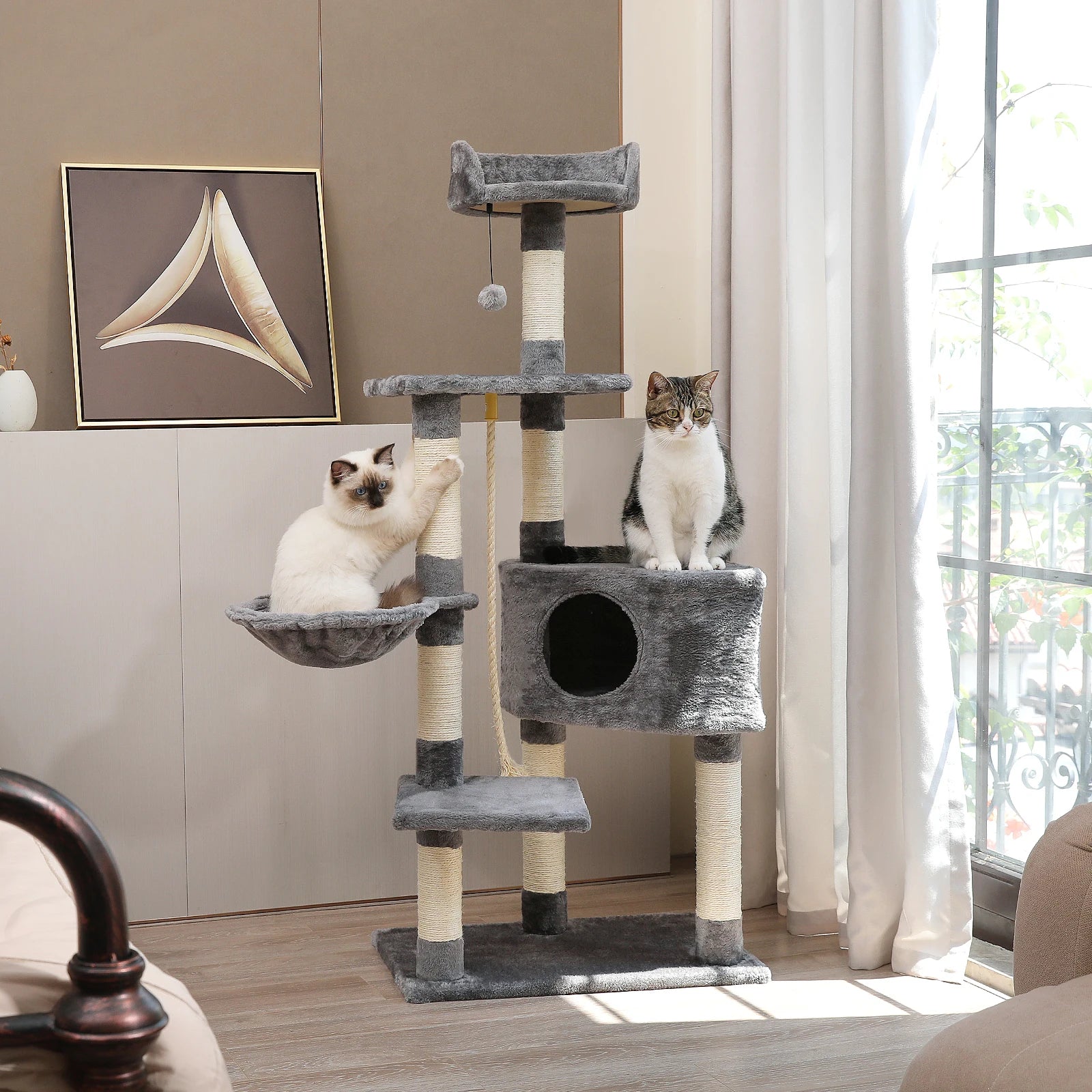 Large multi-layer cat tree tower with scratching posts, hammocks, and cozy condo for indoor cats